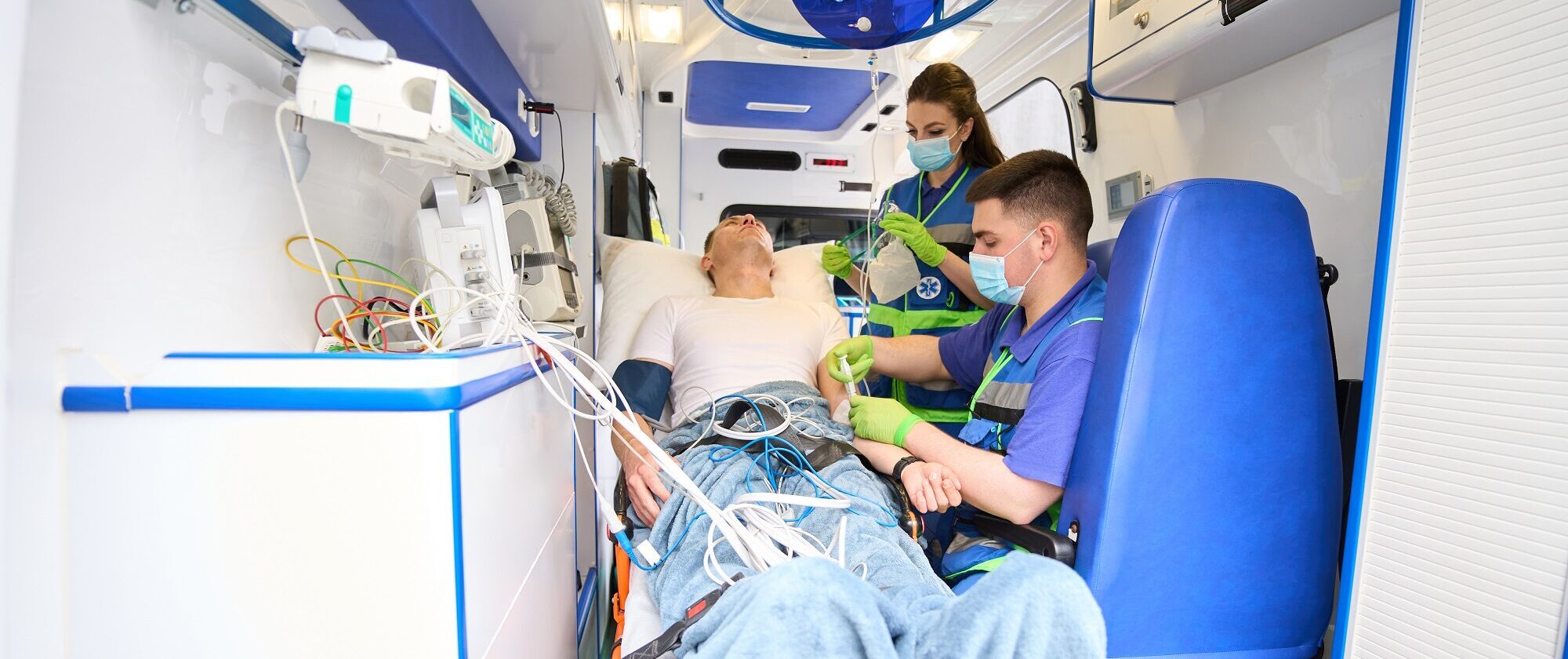 Mobile team of paramedics connects the patient to the drip